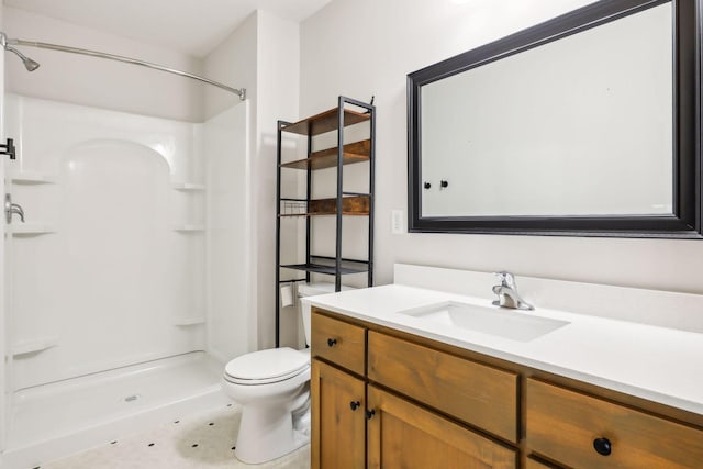 bathroom featuring a shower, tile patterned floors, vanity, and toilet