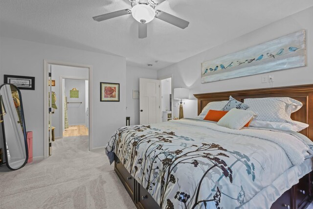 carpeted bedroom featuring ceiling fan and baseboards