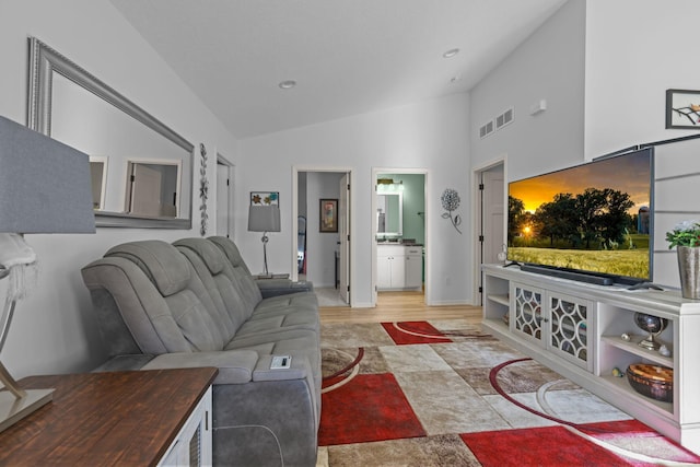 living room featuring lofted ceiling, baseboards, visible vents, and recessed lighting