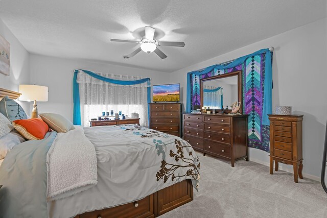 bedroom with carpet flooring, baseboards, and ceiling fan