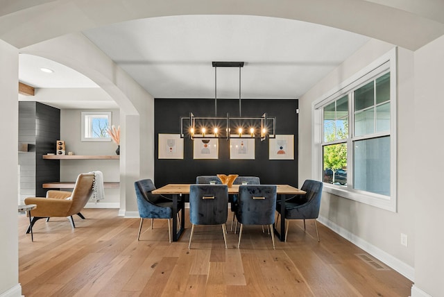 dining space with hardwood / wood-style floors