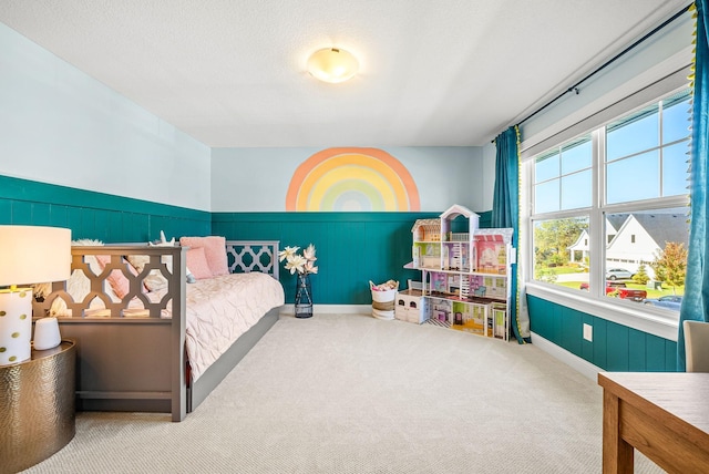 bedroom featuring carpet floors and a textured ceiling