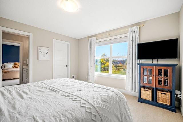 bedroom featuring light colored carpet