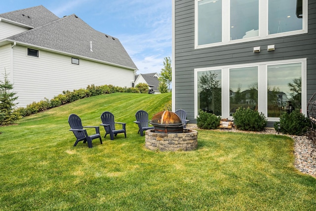 view of yard with an outdoor fire pit