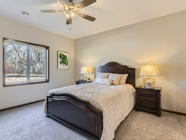 bedroom featuring ceiling fan and light colored carpet