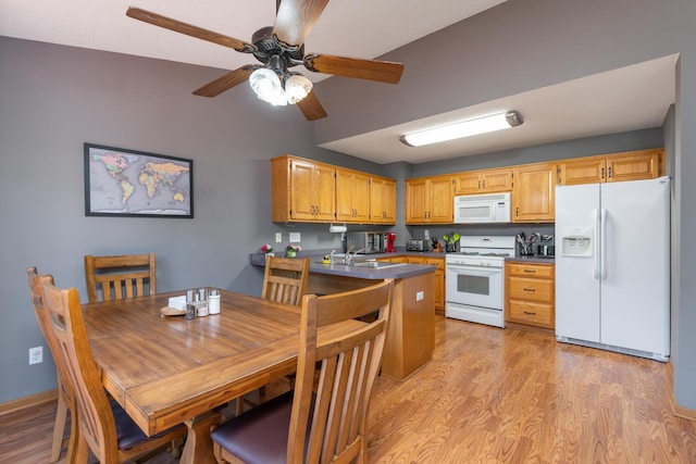 kitchen with ceiling fan, white appliances, and light hardwood / wood-style flooring