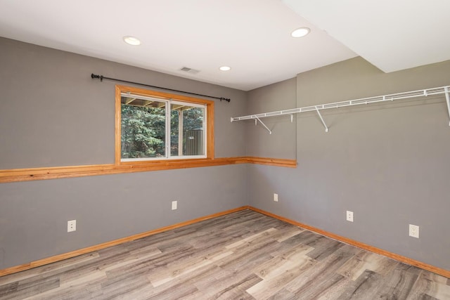 spare room with hardwood / wood-style floors