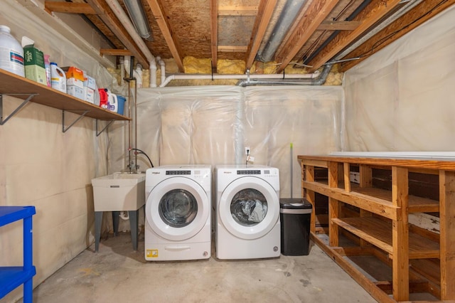 laundry area with washing machine and dryer and sink