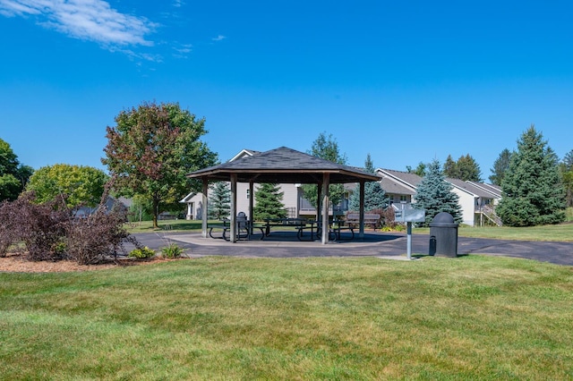 surrounding community with a gazebo and a lawn