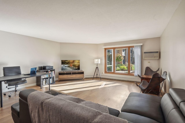 living room with light hardwood / wood-style floors, a baseboard heating unit, and a wall mounted AC