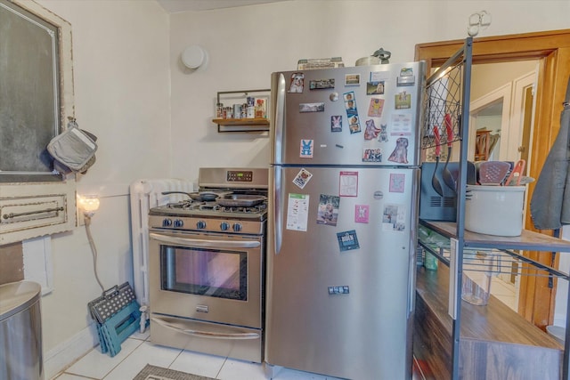 kitchen with tile patterned floors and stainless steel appliances