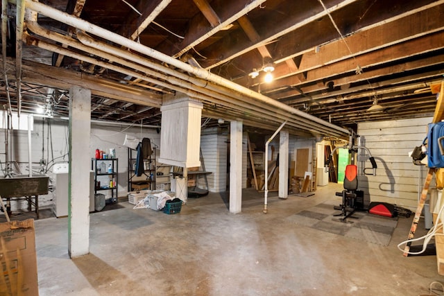 unfinished basement featuring a sink