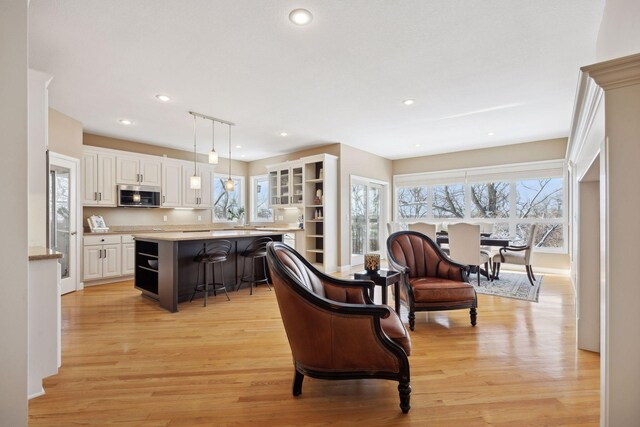 living room with light hardwood / wood-style flooring