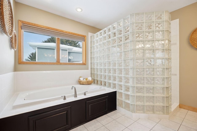 bathroom featuring tile patterned floors and plus walk in shower