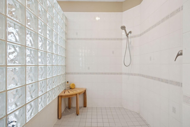 bathroom with a tile shower