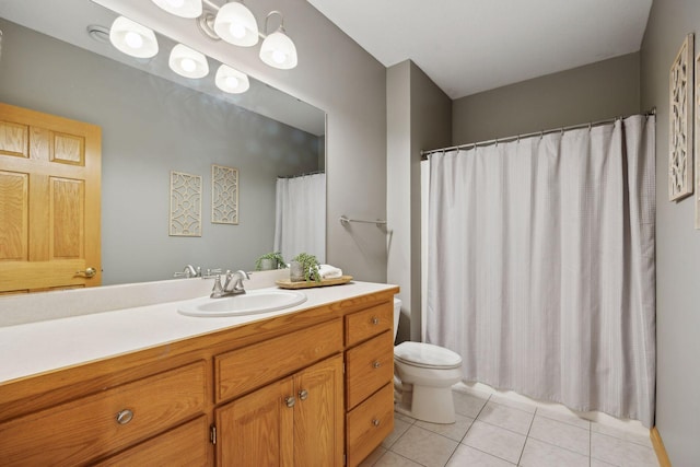 bathroom with tile patterned flooring, vanity, walk in shower, and toilet