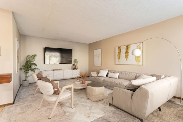 living room featuring light colored carpet and a textured ceiling