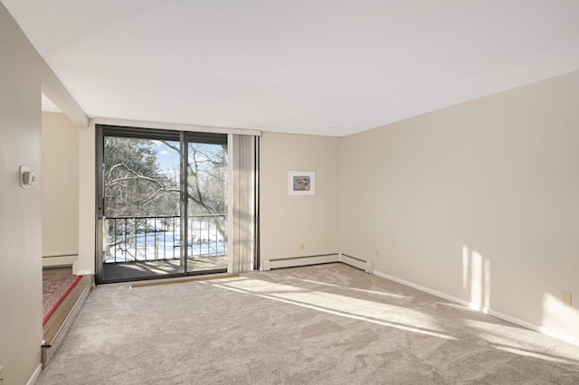 unfurnished room featuring baseboard heating, carpet, and floor to ceiling windows