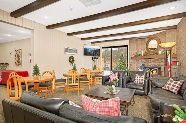 carpeted living room featuring a brick fireplace and beamed ceiling