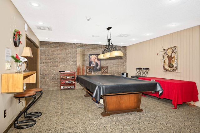 playroom featuring billiards, brick wall, and wood walls