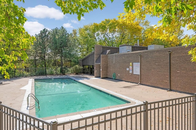 view of pool featuring a patio