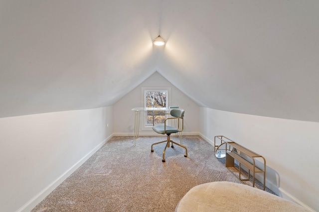 interior space with light colored carpet and lofted ceiling