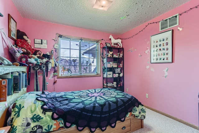 carpeted bedroom with a textured ceiling