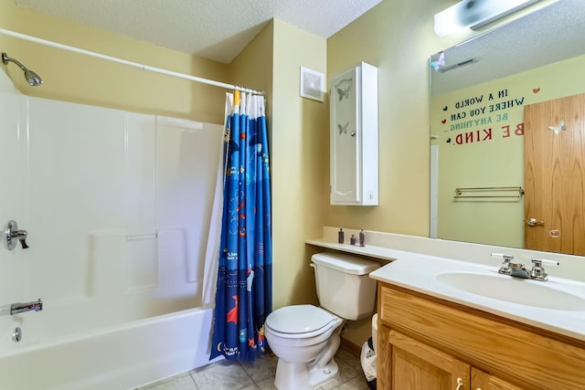 full bathroom with shower / bath combo, tile patterned flooring, vanity, a textured ceiling, and toilet