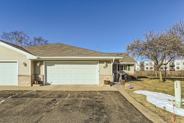 ranch-style house featuring a garage