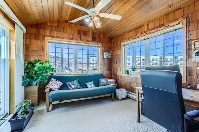 office with wooden walls, a ceiling fan, wood ceiling, vaulted ceiling, and carpet