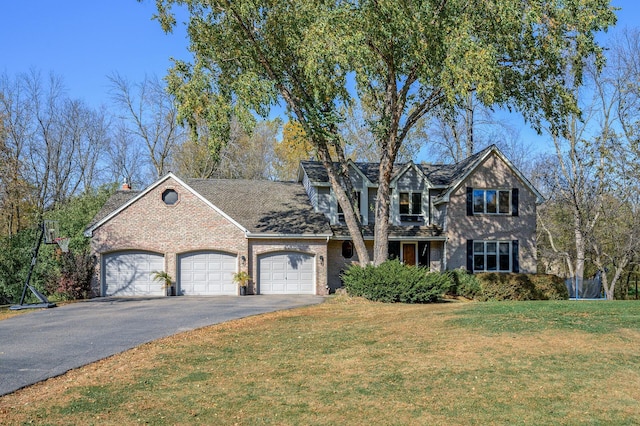 view of front of home featuring a garage and a front lawn