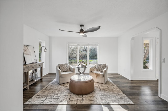 sitting room with ceiling fan, dark hardwood / wood-style flooring, a healthy amount of sunlight, and a textured ceiling