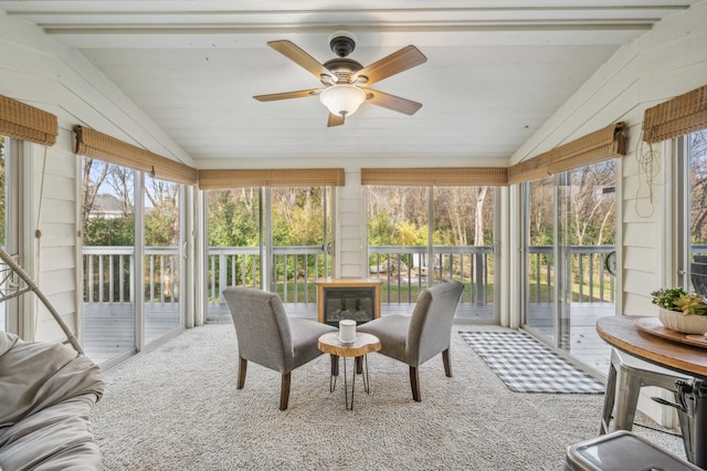 sunroom / solarium with vaulted ceiling and ceiling fan