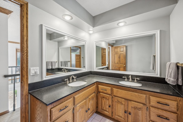 bathroom featuring tile patterned floors and vanity