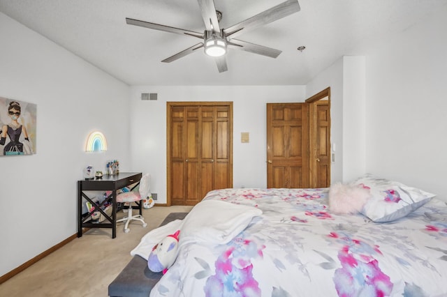 carpeted bedroom with ceiling fan and a closet