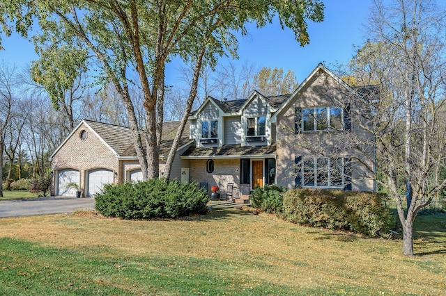 view of front facade featuring a front lawn and a garage