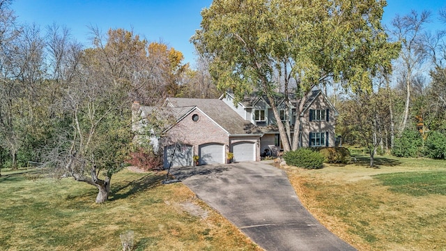 view of front of home with a garage and a front yard