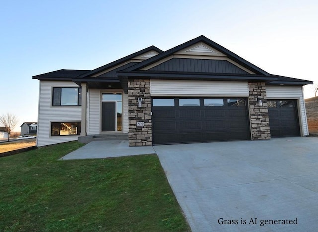 view of front of property featuring a front yard and a garage