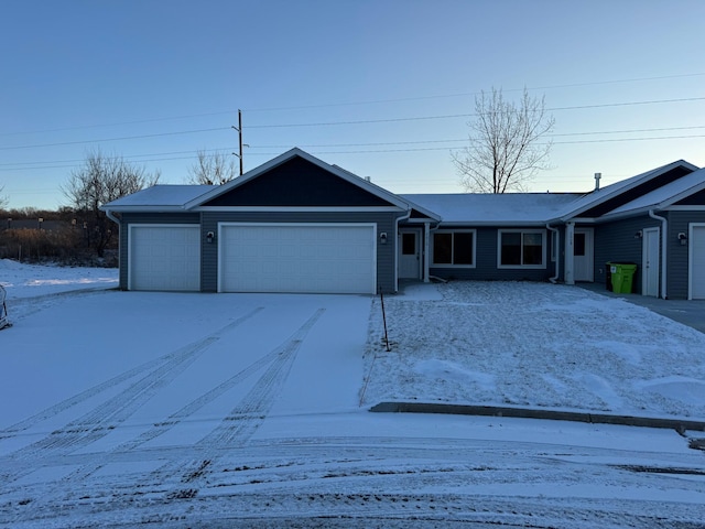 ranch-style house featuring a garage