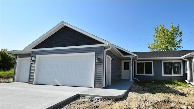 ranch-style home featuring a garage