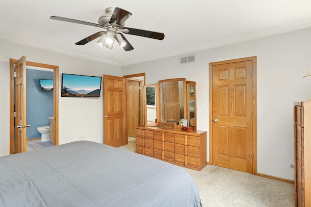 carpeted bedroom featuring ceiling fan, crown molding, and connected bathroom