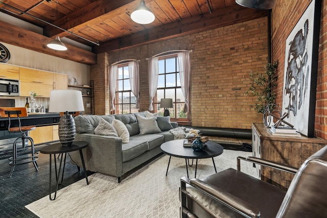 living room with beam ceiling, wood ceiling, and brick wall