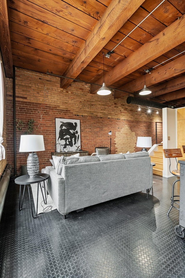 unfurnished living room with wood ceiling, beamed ceiling, and brick wall