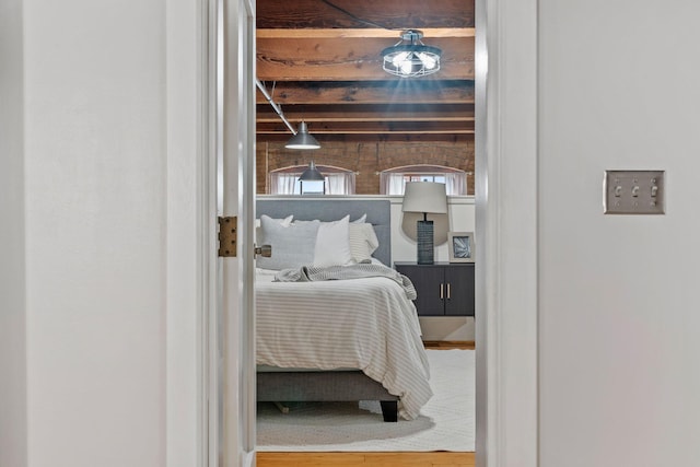 bedroom featuring beam ceiling