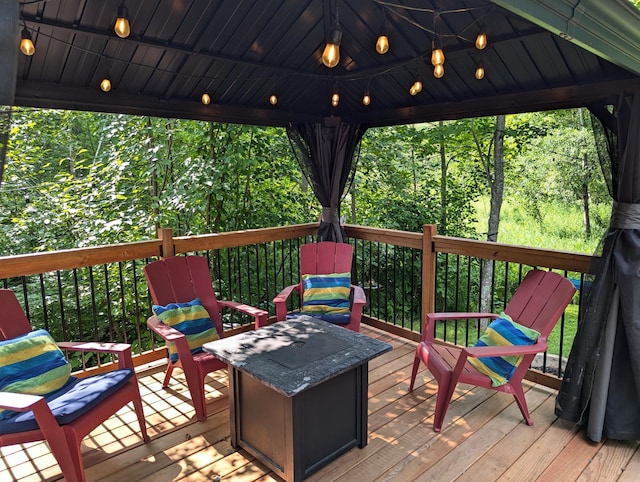 wooden deck featuring a gazebo