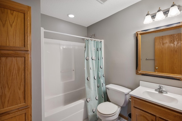 full bathroom with shower / tub combo, vanity, a textured ceiling, and toilet