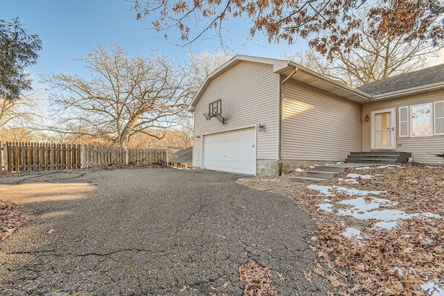 view of property exterior featuring a garage