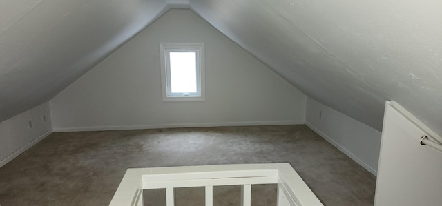 bonus room featuring carpet floors and lofted ceiling