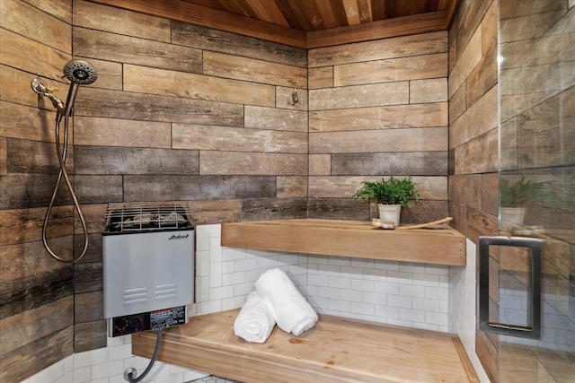 bathroom featuring a shower, wooden ceiling, and wood walls