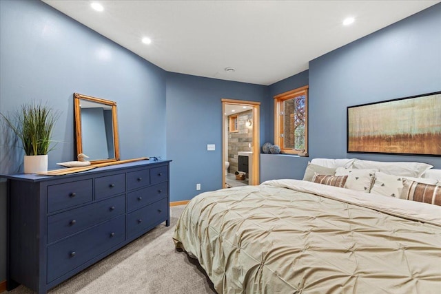 carpeted bedroom with ensuite bath